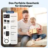 A father and daughter are sitting on a couch, with the daughter opening a gift. Produktbild-Vorschau