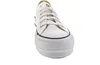 A white Converse sneaker with a platform sole is shown from the front. Voir les images du produit