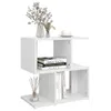A white, modern, zig-zag shaped side table with books and decorative items on it. Produktbild-Vorschau