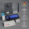 A collection of smart home intercom system components arranged on a textured gray surface, with promotional badges on the right. Produktbild-Vorschau