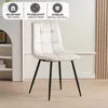 A beige upholstered dining chair with black metal legs is shown in a room with a white bookshelf on the left and a beige wall with wooden slats on the right. Above the chair, there are three circular icons with text describing product features. Náhled obrázku produktu
