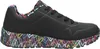 A side view of a single black sneaker with a colorful heart pattern on the sole and collar. Voir les images du produit