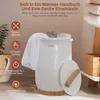 A white towel warmer with a wooden lid and base, with towels draped over it and inside. It is placed on a floor with a basket and a wooden shelf in the background. Podgląd zdjęcia produktu