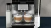 A Siemens coffee machine is making two lattes into glass cups. Produktbild-Vorschau