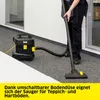 A person is vacuuming a carpeted hallway with a Kärcher vacuum cleaner. Voir les images du produit