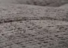 A close-up, textured view of a dark gray fabric. Podgląd zdjęcia produktu