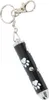 A black laser pointer with white paw print designs and a silver tip, attached to a keychain. Anteprima dell’immagine prodotto