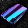 A close-up shot of a smartphone case with a gradient color effect, placed on a dark, textured surface. Produktbild-Vorschau