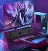 A person's hands are on a keyboard and mouse, with a computer monitor, soundbar, and subwoofer in front of them, suggesting a gaming or computer setup. Voir les images du produit