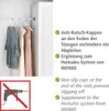 A closet rod with three dresses hanging on it, next to a white wardrobe. Text describes product features. Produktbild-Vorschau