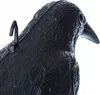 Close-up of a black plastic crow decoy, showing its textured surface and a hanging hook. Podgląd zdjęcia produktu