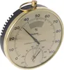 A close-up, angled view of a Technoline analog thermo-hygrometer with a brass-colored casing and a black textured side. Anteprima dell’immagine prodotto