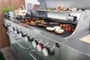 A close-up view of a stainless steel gas grill with food cooking on it. Podgląd zdjęcia produktu