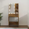 A vanity table with a lighted mirror and shelves, placed against a wall. Náhľad obrázku produktu