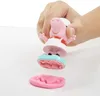 A hand holding a Peppa Pig toy that is part of a Play-Doh playset, with pink Play-Doh being molded. Anteprima dell’immagine prodotto