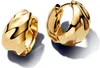 A pair of gold hoop earrings with a textured, organic design. Produktbild-Vorschau