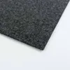 A close-up, angled view of a dark gray carpet tile on a white background. Produktbild-Vorschau