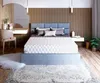 A bedroom scene with a bed, vanity, and rug. Produktbild-Vorschau