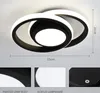 A modern LED ceiling light with a black and white circular design, shown against a white background with dimensions indicated. Produktbild-Vorschau