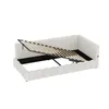 A white upholstered bed frame with the mattress support mechanism lifted to reveal storage space underneath. Voir les images du produit