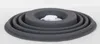 A gray collapsible silicone food storage container lid sits on a white surface. Voir les images du produit