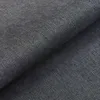 A close-up view of a dark gray woven fabric, likely upholstery or bedding material. Produktbild-Vorschau