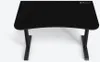 A black gaming desk with curved edges and metal legs, shown from a slightly elevated front-left angle against a plain white background. Voir les images du produit