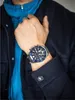A man wearing a watch and jacket. Anteprima dell’immagine prodotto