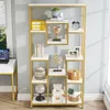 A modern, gold and white bookshelf filled with decorative items and books. Produktbild-Vorschau