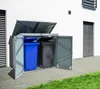 A metal trash can enclosure with two bins, one blue and one black, is shown outdoors next to a white building. Náhled obrázku produktu