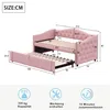 A diagram showing the dimensions of a pink upholstered daybed with a pull-out trundle bed. Produktbild-Vorschau
