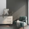 A modern living room scene with a sideboard, artwork, and a chair. Produktbild-Vorschau