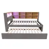 A daybed with a pull-out trundle bed, featuring a bookshelf headboard with LED lighting. Voir les images du produit