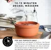 Water being poured into a terracotta pot, with kitchen scales and ingredients in the background. Produktbild-Vorschau