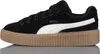 A side view of a black Puma Creeper Phatty sneaker with a white stripe and a thick gum sole. Anteprima dell’immagine prodotto