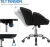 A black office chair is shown with diagrams illustrating its tilt tension feature. Produktbild-Vorschau