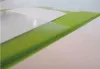 A close-up, angled view of a stack of green plastic sheets, likely part of a document folder or organizer, with a white surface underneath. Produktbild-Vorschau