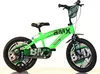 A green BMX bicycle with black tires and accents, shown against a white background.