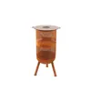 A rusty metal fire pit with a lid and three legs, presented on a white background. Produktbild-Vorschau