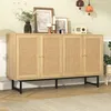A wooden sideboard with woven doors is displayed in a room with decorative items on top. Náhľad obrázku produktu