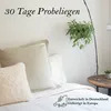 A bed with pillows and a hanging plant, with text overlay. Produktbild-Vorschau
