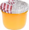 A glass jar filled with an orange substance, sealed with a lid covered by a red and white checkered fabric and a wooden-patterned lid. Náhled obrázku produktu