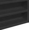 A close-up view of the shelves of a black cabinet. Produktbild-Vorschau