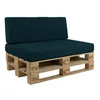 A dark green cushion set on a wooden pallet base, presented against a white background. Produktbild-Vorschau