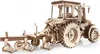 A wooden model of a tractor with a plow attached, shown against a white background. Náhľad obrázku produktu
