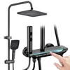 A black shower system with a digital display and atmospheric lighting, with a hand interacting with the display. Podgląd zdjęcia produktu
