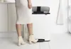 A person is using a white Brabantia Bo pedal bin in a kitchen. Náhľad obrázku produktu