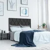 A bedroom scene with a bed, headboard, and decorative items. Náhled obrázku produktu