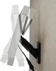 A black solar pump mount with a cable attached, shown on a textured wall. The mount is shown in multiple positions to demonstrate its adjustability, with ghosted images of the attached white pump. Produktbild-Vorschau