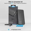 A Voomy power bank and its accessories are displayed on a light gray background. Produktbild-Vorschau